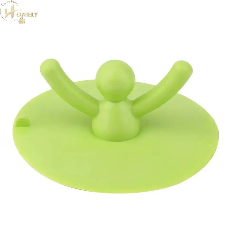 Kitchen Waterproof Sink Plug in green silicone shape with a figure, designed for anti-leak and universal fit.