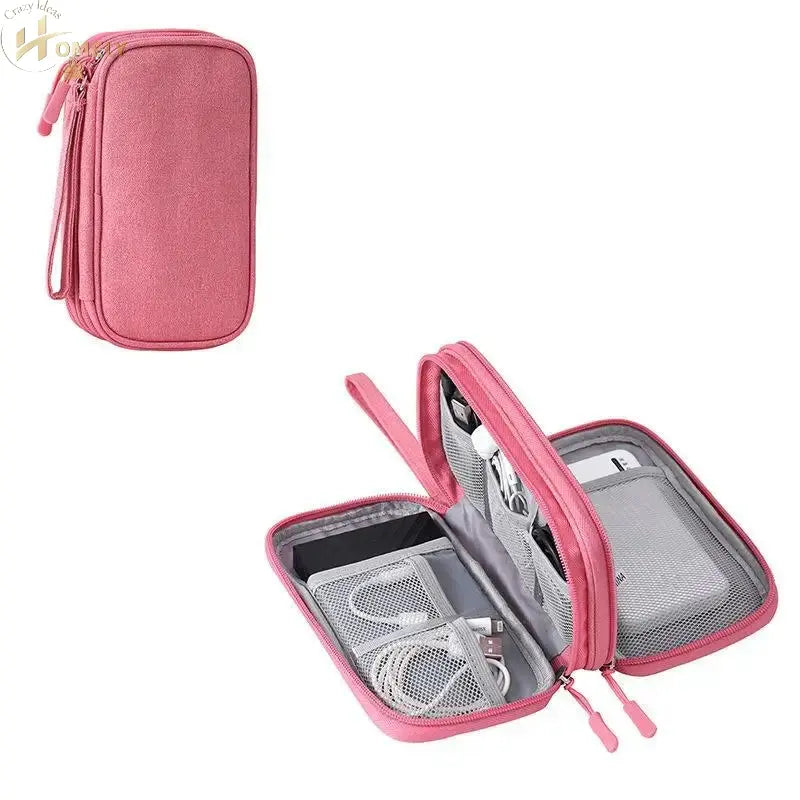 Travel Organizer multi-compartment storage bag in pink, open showing organized cables and accessories.