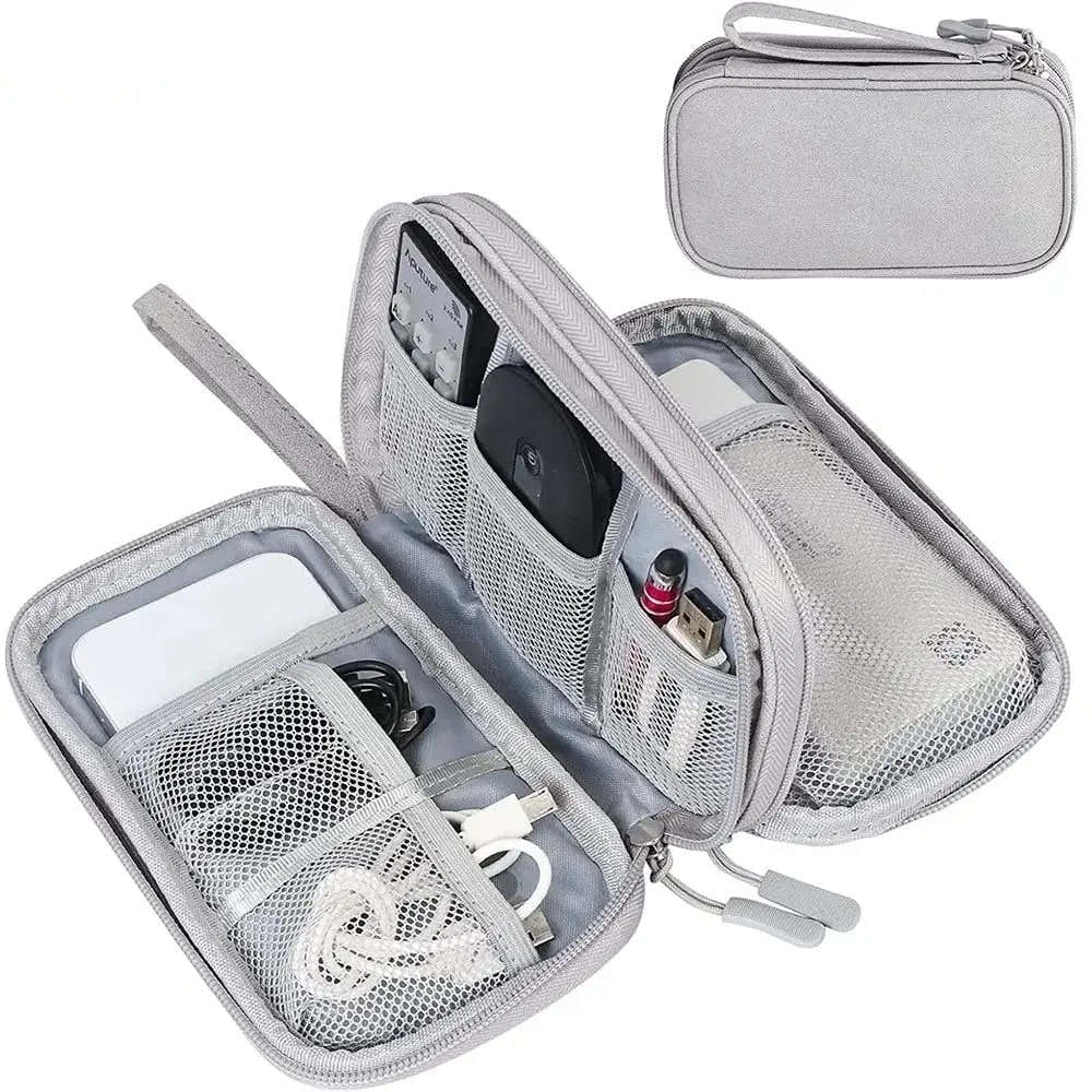 Travel Organizer open showing multi-compartment storage for electronics accessories and cables.